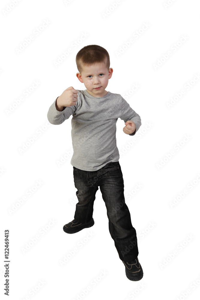 Little boy in aggressive posture is going to fight isolated in full height on white background Little boy in aggressive posture is going to fight isolated in full height on white background