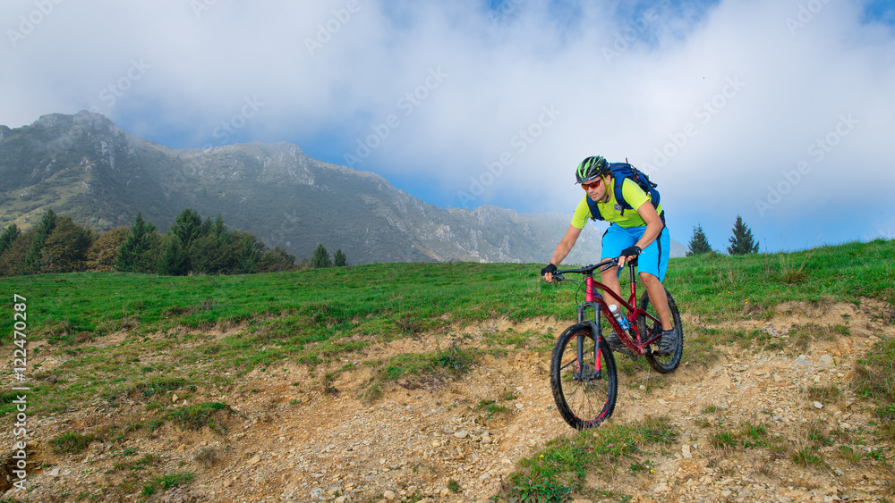 A young male riding a mountain bike outdoor A young male riding a mountain bike outdoor