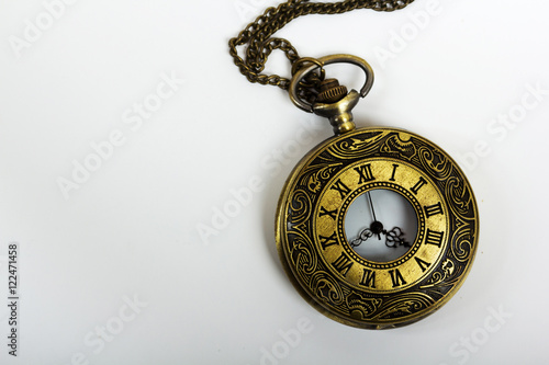 Pocket watch against a light background