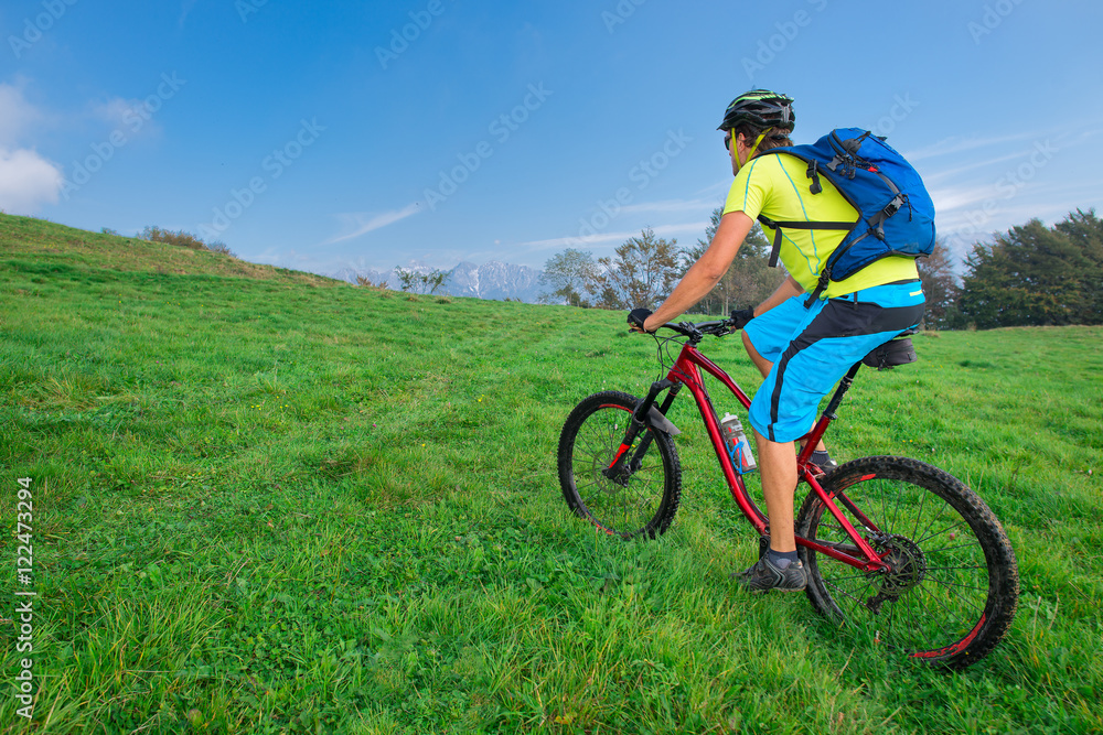 A young male riding a mountain bike outdoor A young male riding a mountain bike outdoor