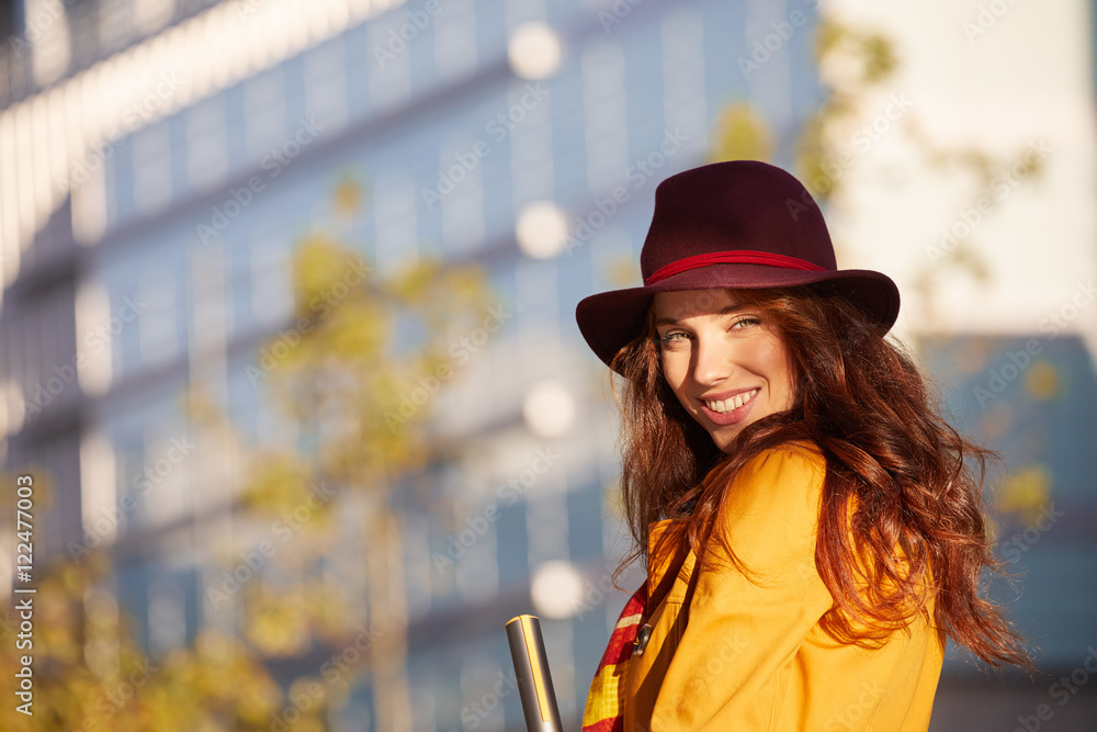 Young beautiful woman in sun autumn street. outdoor city Young beautiful woman in sun autumn street. outdoor city