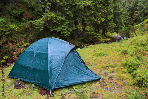 tourist tent in rainy forest