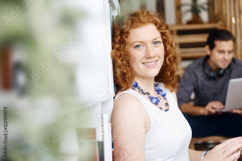 Portrait of two young people sitting at the stairs in office Free Download Portrait of two young people sitting at the stairs in office - GFXLoad