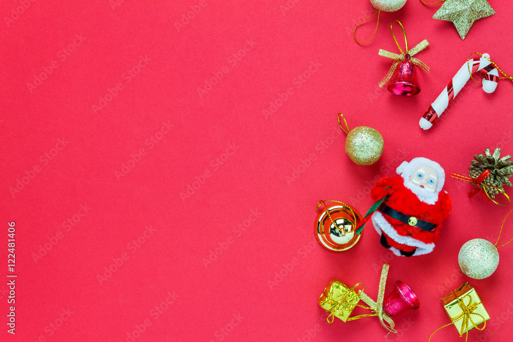 Top view Christmas decoration and Santa Claus doll on red . Top view Christmas decoration and Santa Claus doll on red .