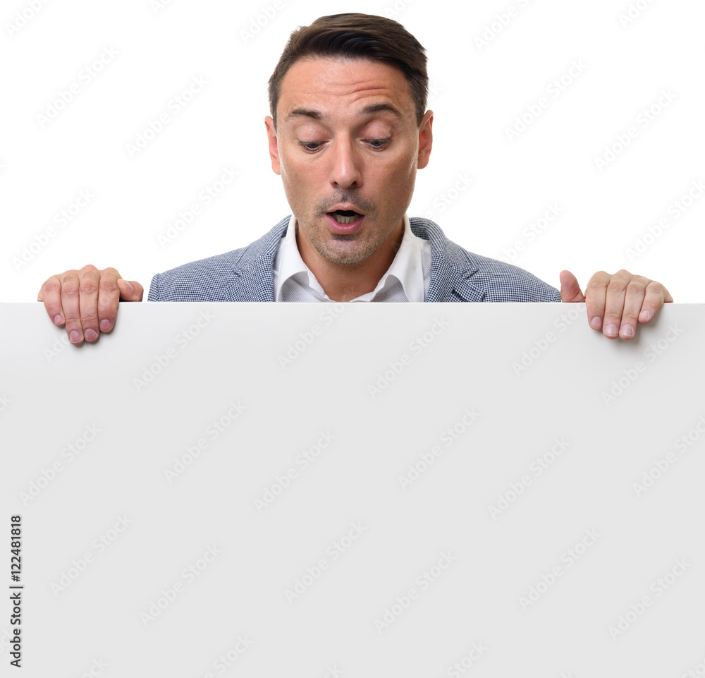 surprised man holding a blank sheet surprised man holding a blank sheet