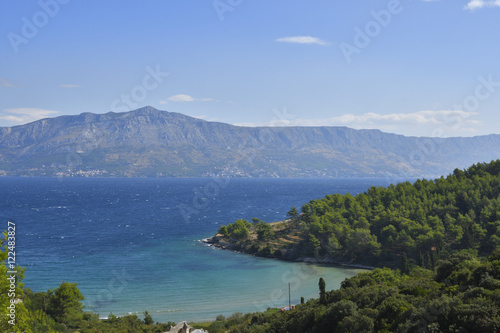 Nice beach with blue water and a blue sky  picture from Island Brac in Croatia.