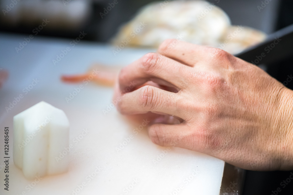Close up hand of Japanese chef making sushi

