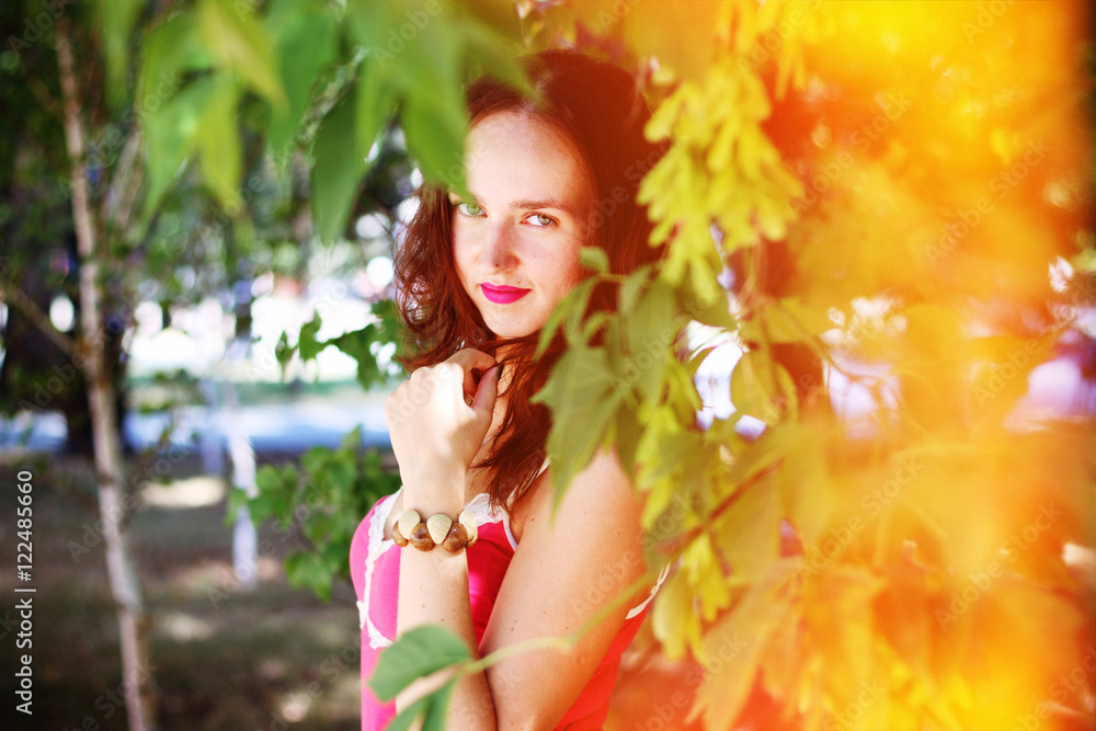 Portrait of a young Frenchwoman in the branches of trees Portrait of a young Frenchwoman in the branches of trees