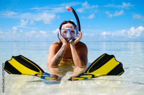 Snorkeler woman having fun on the tropical beach.