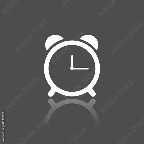 Icono de reloj despertador sobre un fondo negro