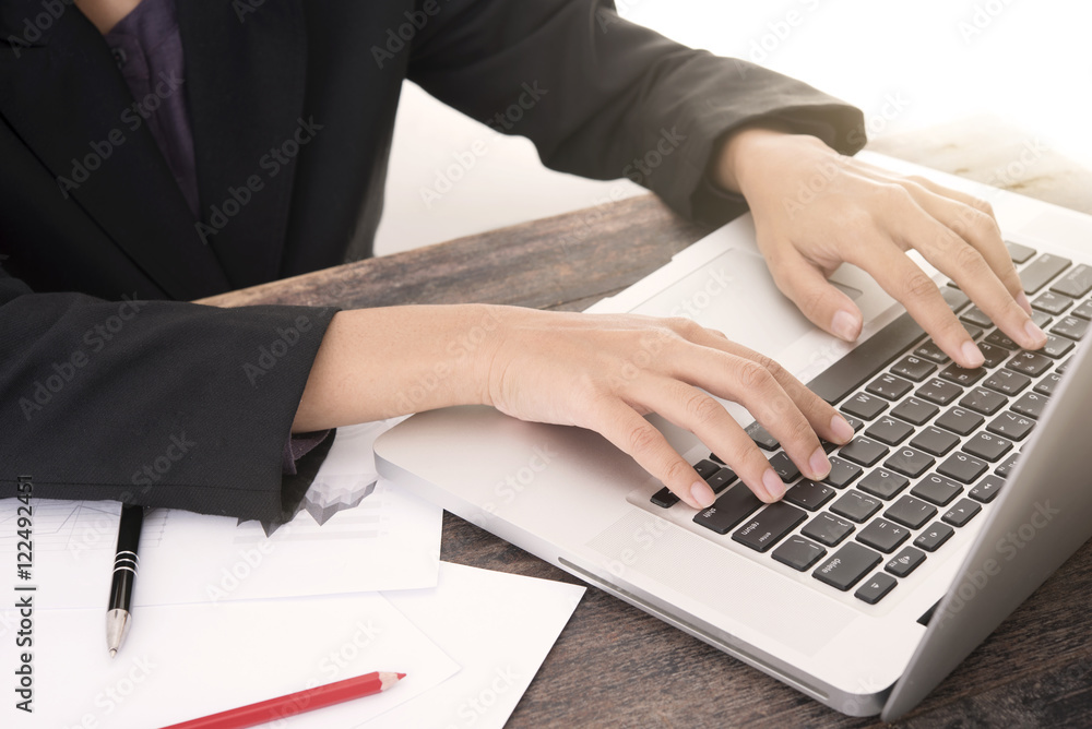 business woman working about business investment report on computer in office. business woman working about business investment report on computer in office.
