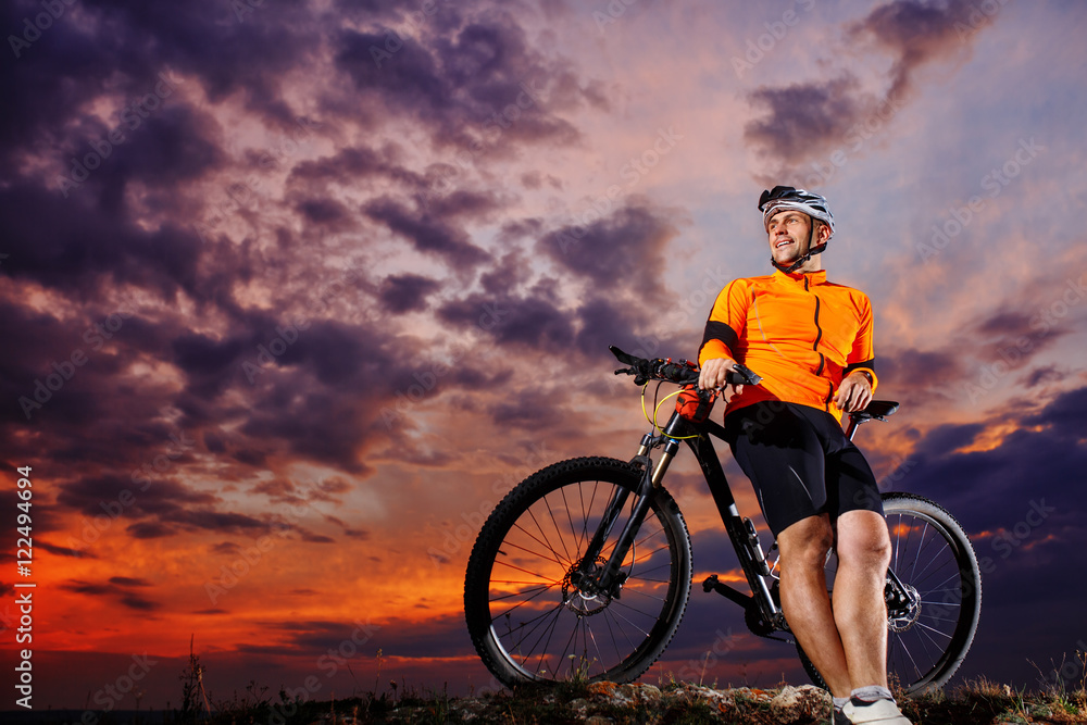 Man in helmet and glasses stay on the bicycle Man in helmet and glasses stay on the bicycle