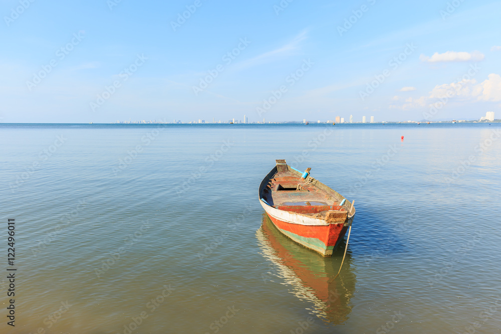 old wood fishing boat at anchor in sea
