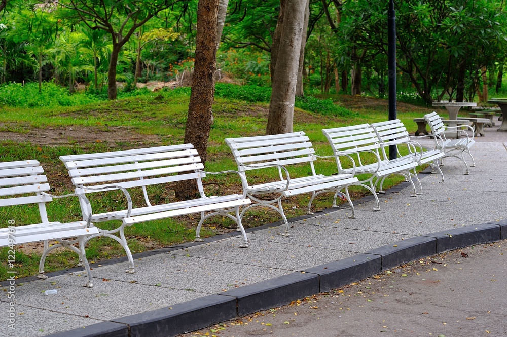 White benches in the park