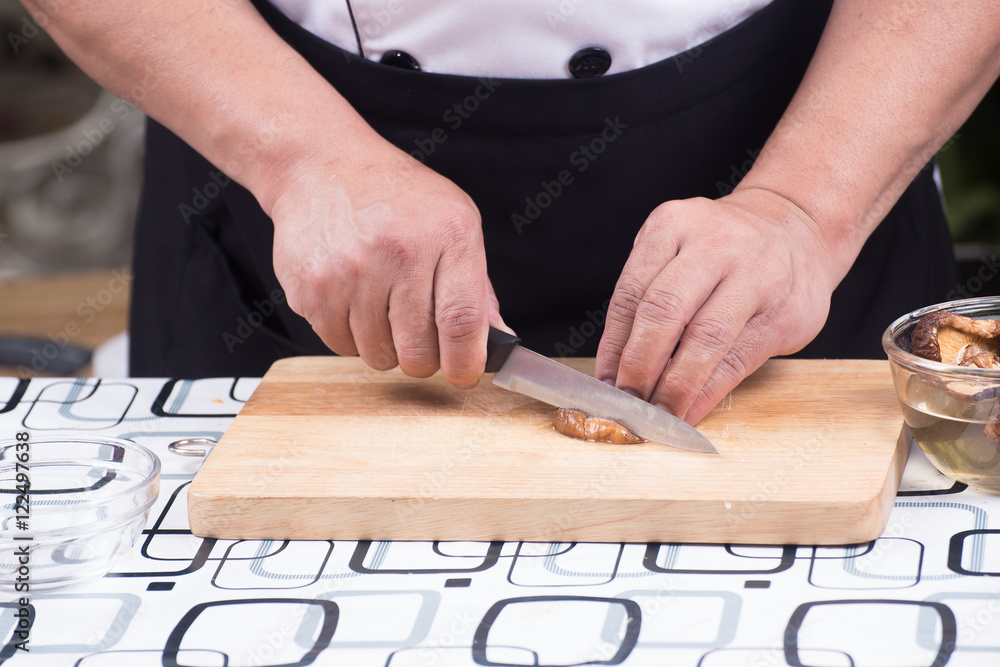 Chef is cutting mushroom Chef is cutting mushroom