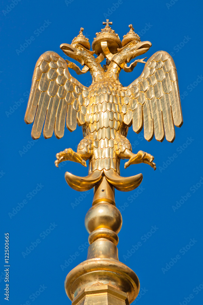 State eagle on spire with cathedral Savior on Spilled Blood in St. Petersburg