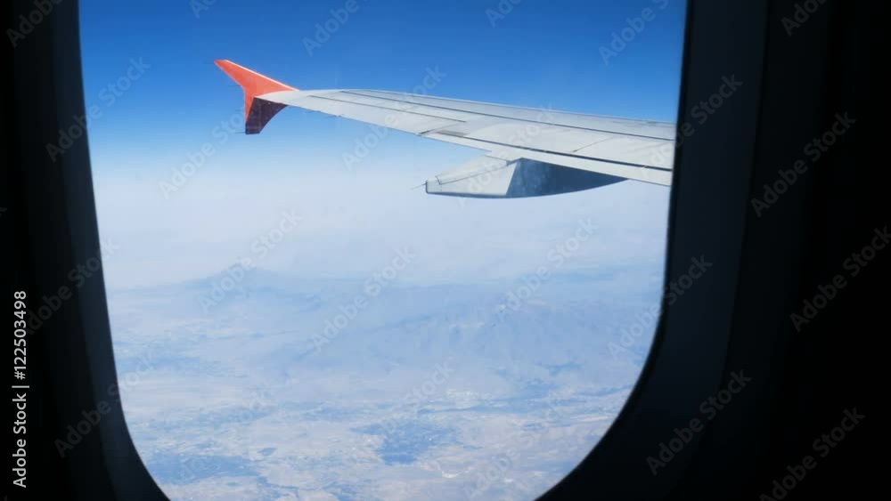 The wing aircraft in altitude during flight, handheld shot The wing aircraft in altitude during flight, handheld shot