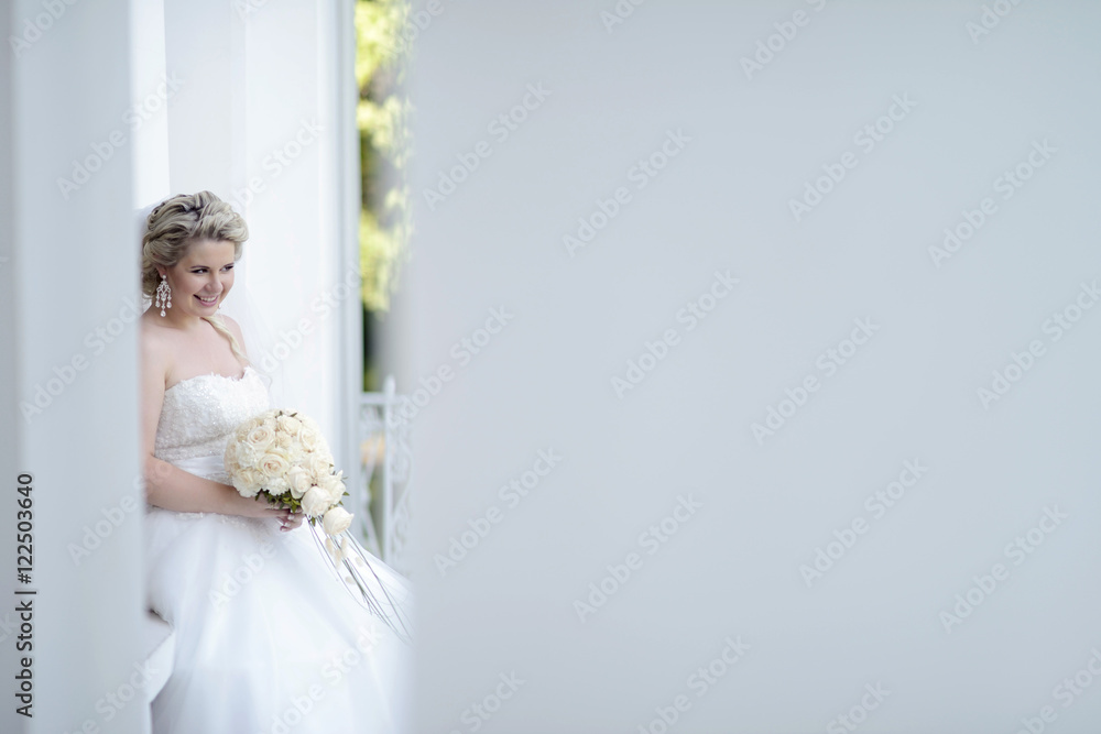 Beauty bride in bridal gown with bouquet and lace veil on the nature. Beautiful model girl in a white wedding dress. Female portrait in the park. Woman with hairstyle. Cute lady outdoors Beauty bride in bridal gown with bouquet and lace veil on the nature. Beautiful model girl in a white wedding dress. Female portrait in the park. Woman with hairstyle. Cute lady outdoors