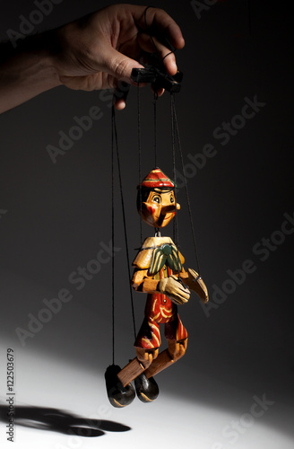 Obraz na plátně Pinocchio liar doll with big nose isolated on background