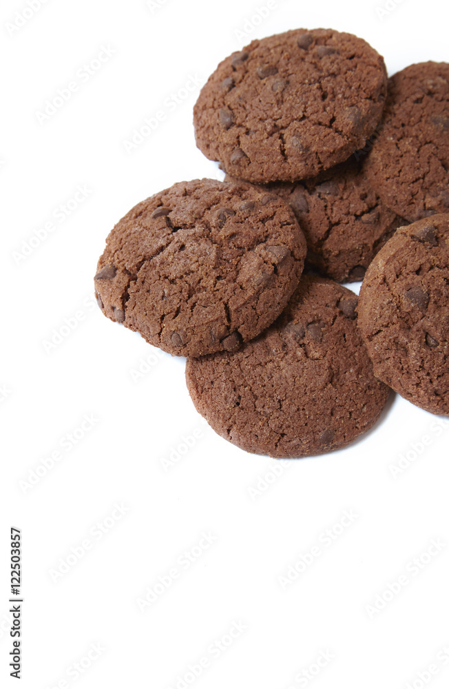 A pile of chocolate chunk cookies isolated on a white background forming a page border A pile of chocolate chunk cookies isolated on a white background forming a page border