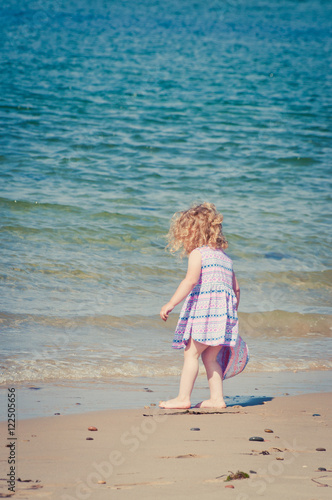 Toddler having fun on the beach