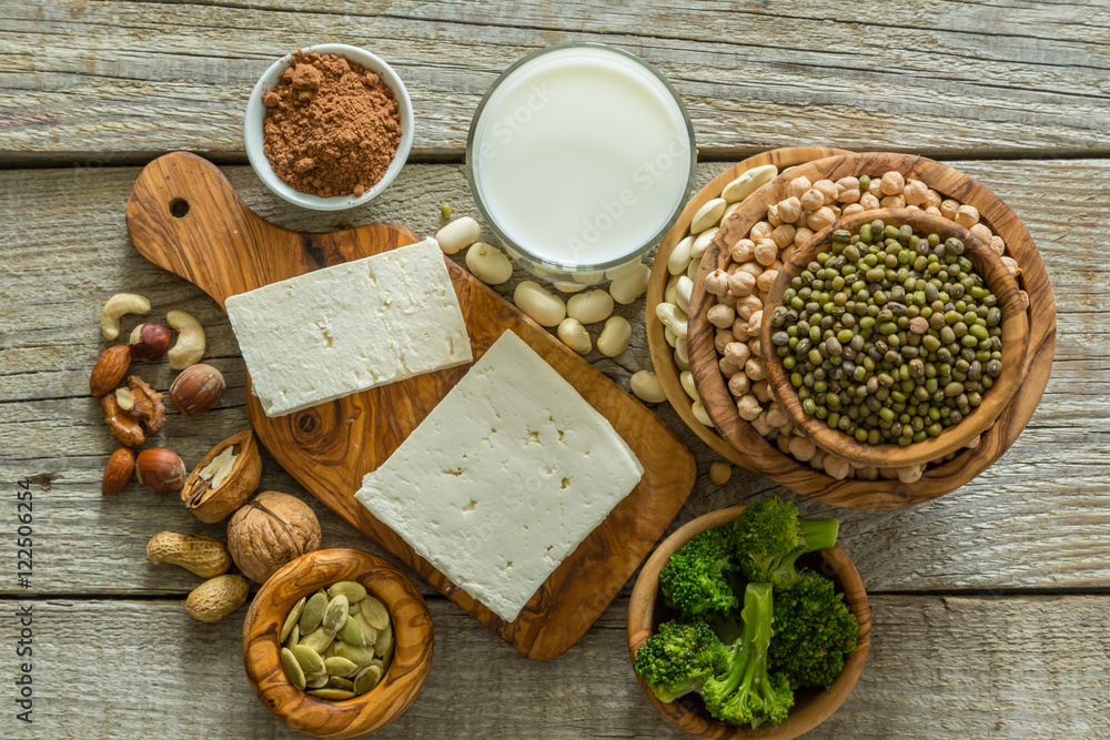 Selection vegan protein sources on wood background Selection vegan protein sources on wood background