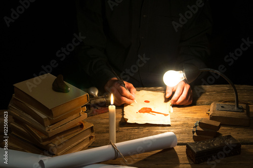 Man writing a letter with quill and sealing. Vintage