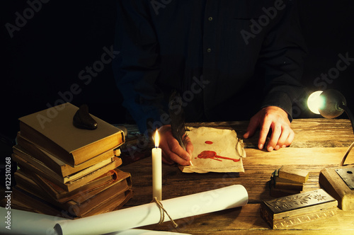 Man writing a letter with quill and sealing. Vintage