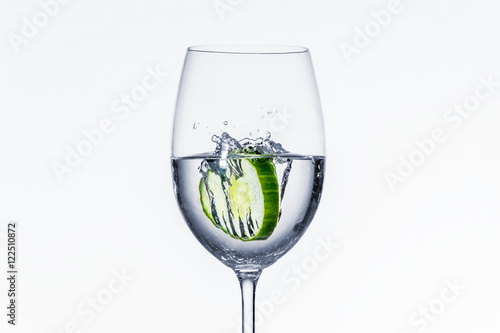 Cucumber drops into wine glass