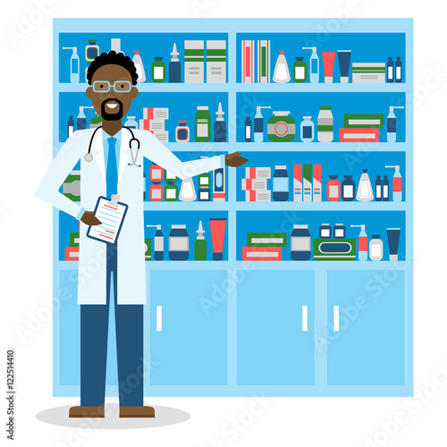 Pharmacist in drug store. Pharmacist in drug store. Handsome smiling african american man in white standing near shelf with medication. Man in glasses.