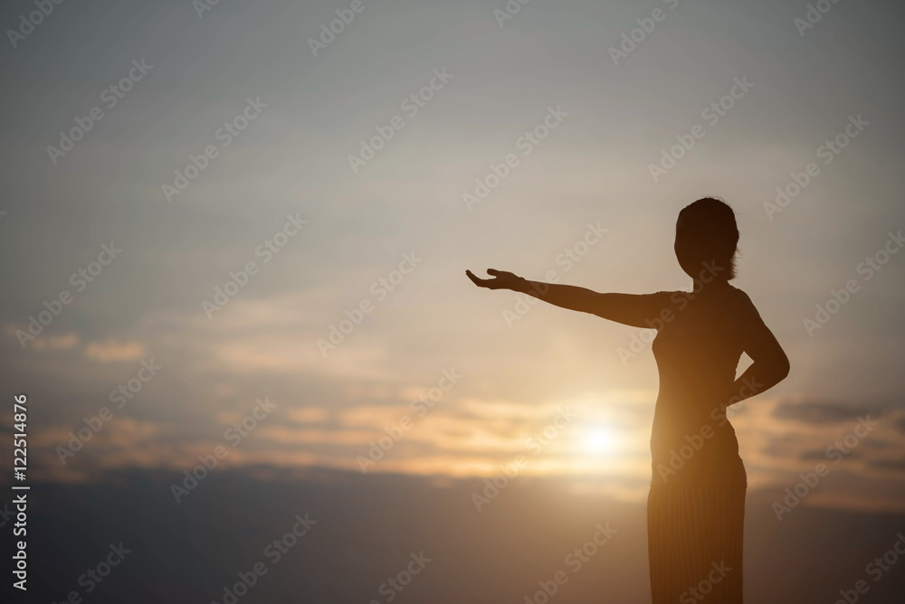 silhouette young woman at sunset