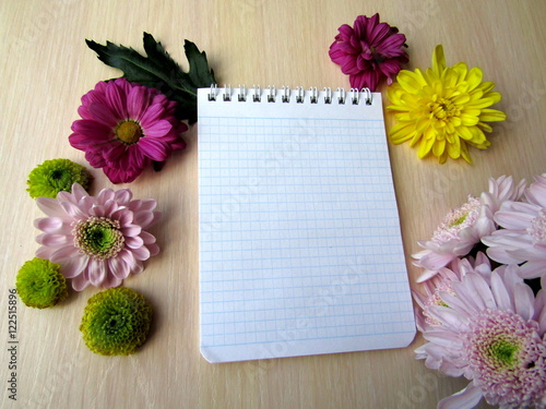 Notebook is open for inscription with flowers