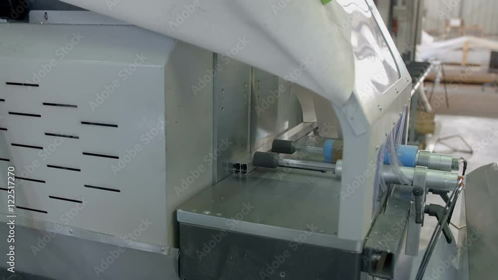 A machine opens up during the work on a production line. It is a busy day in the factory. Close-up shot.
A machine opens up during the work on a production line. It is a busy day in the factory. Close-up shot.