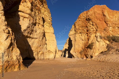 Early morning on the beach of Praia da Rocha, Portimao Coast. Algarve. Portugal