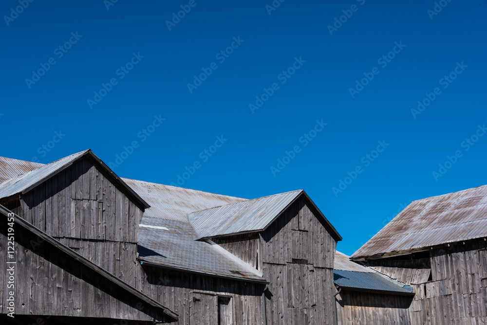 barn gable roof against clear blue sky