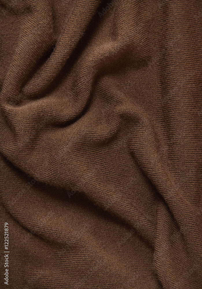 A full page of brown fine knitted background texture A full page of brown fine knitted background texture