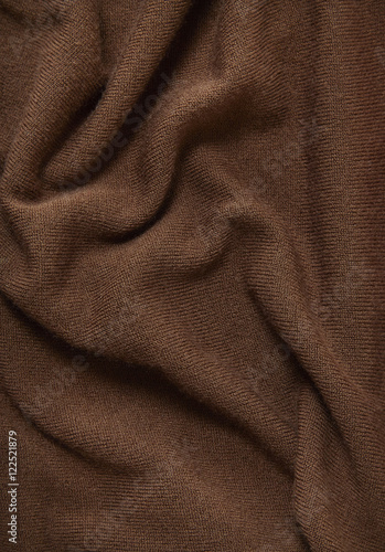 A full page of brown fine knitted background texture
