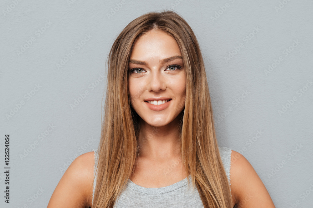 Close up portrait of casual smiling girl looking at camera Close up portrait of casual smiling girl looking at camera