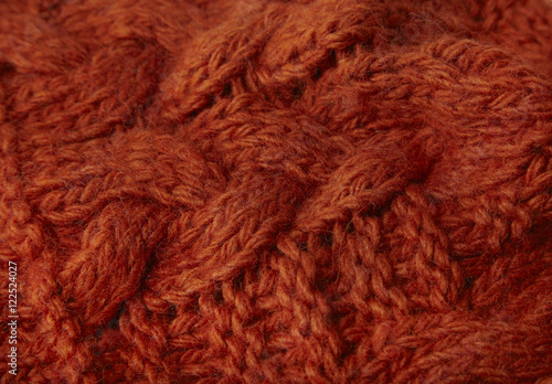 A full page of burnt orange chunky knitted background texture