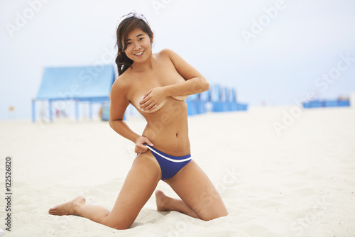 Asian Beauty Playing on Beach