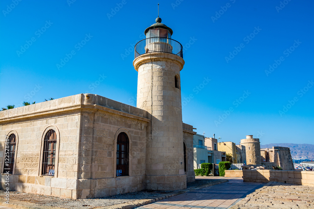 View of the lighthouse and fort in Roquetas de Mar, Almeria region, Costa Tropica, Spain