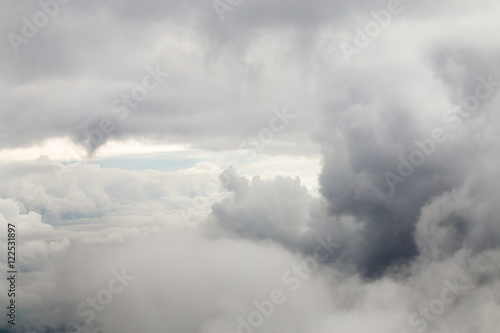 Closeup large gray clouds in the sky the view from the airplane window.