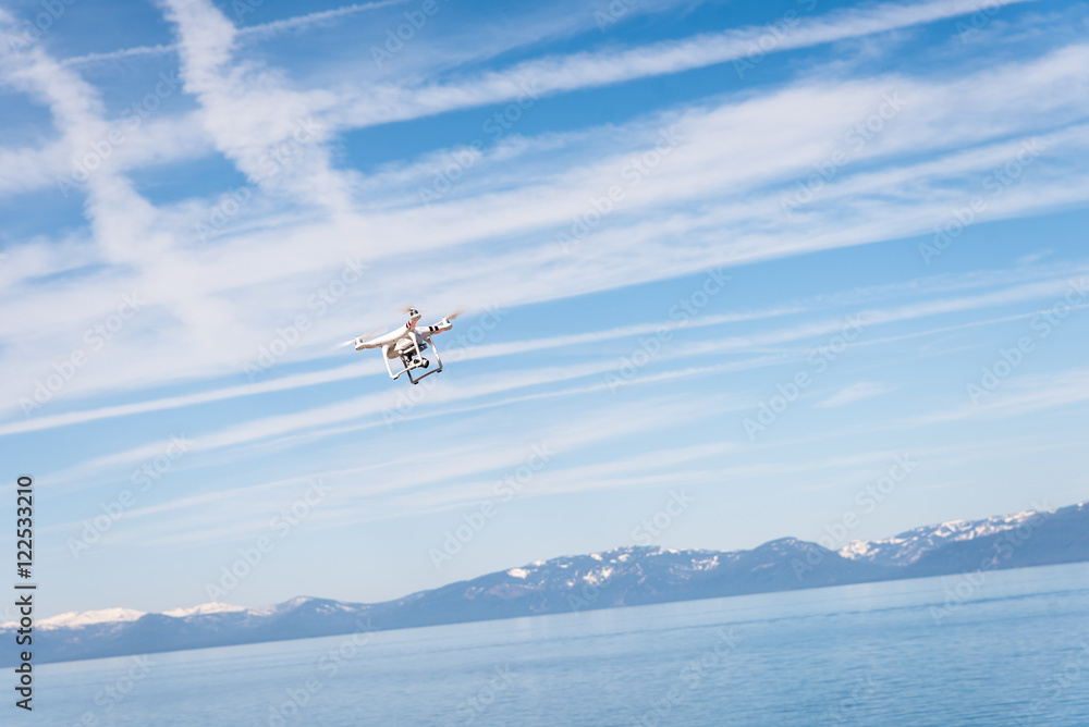 Drone hovering over lake Tahoe waters Drone hovering over lake Tahoe waters