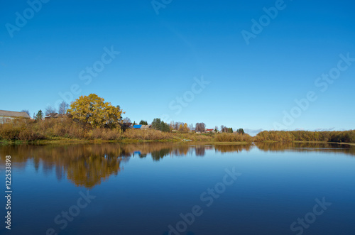 Fall River, reflected in the water autumn trees.