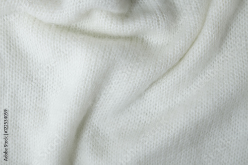 A full page of fine white knitwear fabric texture