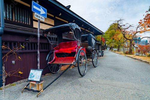 Japanese rickshaw or old style two wheeled passenger cart in Tak photo