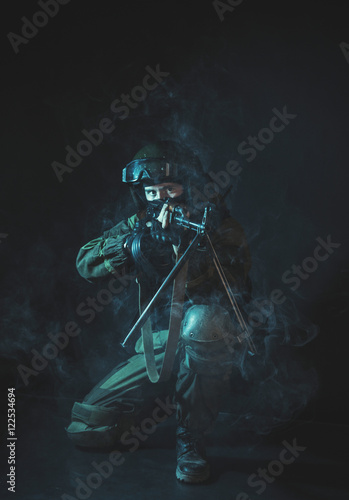 The man in the image of a member of the special forces division with a machine gun. Russian police special force - Special Rapid Response Unit or SOBR  Spetsnaz .