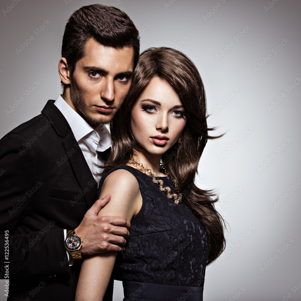 Studio portrait of young beautiful couple in love
