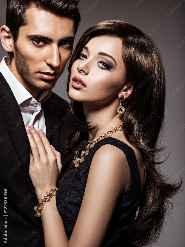 Studio portrait of young beautiful flirting  couple in love