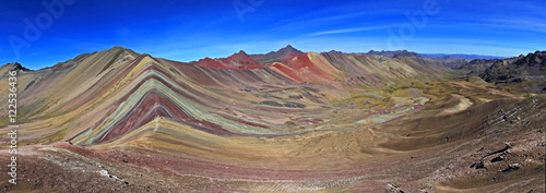 The total panorama of the beautiful colored Rainbow Mountain, near Cusco in the peruvian mountains. Located about 20km south of Ausangate mountain. photo